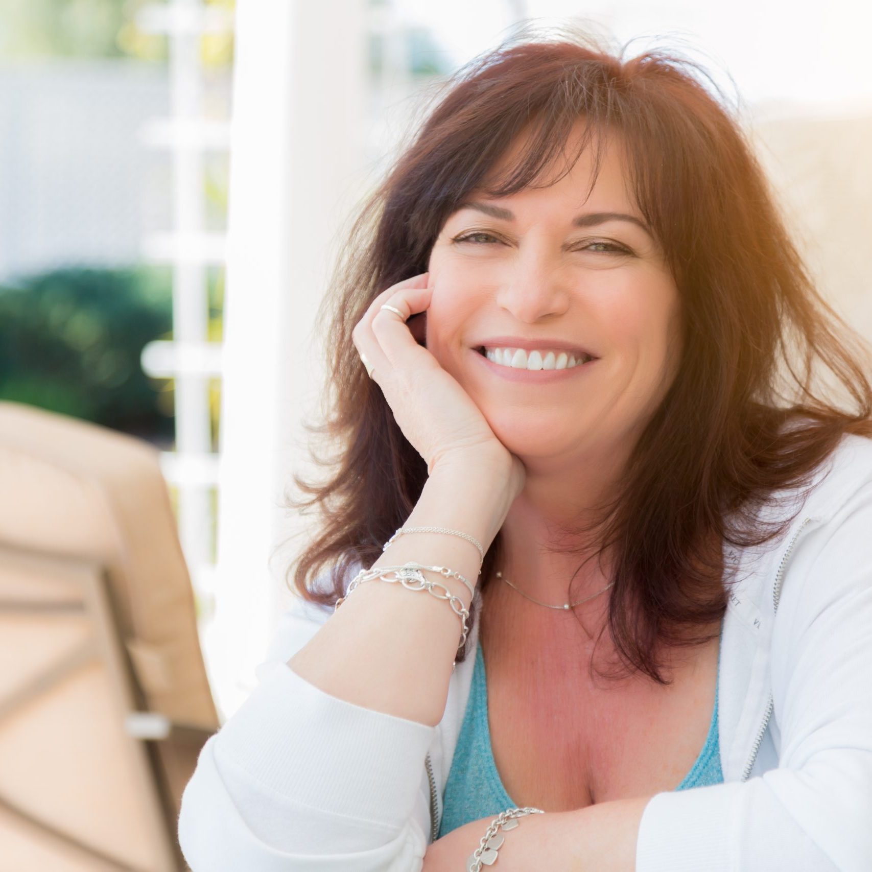 Attractive Middle Aged Woman Smiles On The Patio.