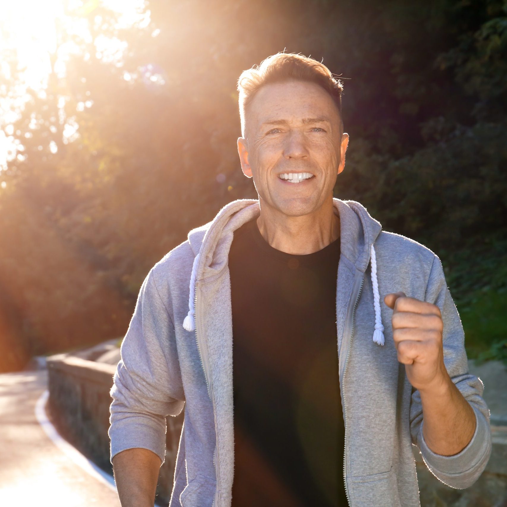 Mature sporty man running outdoors