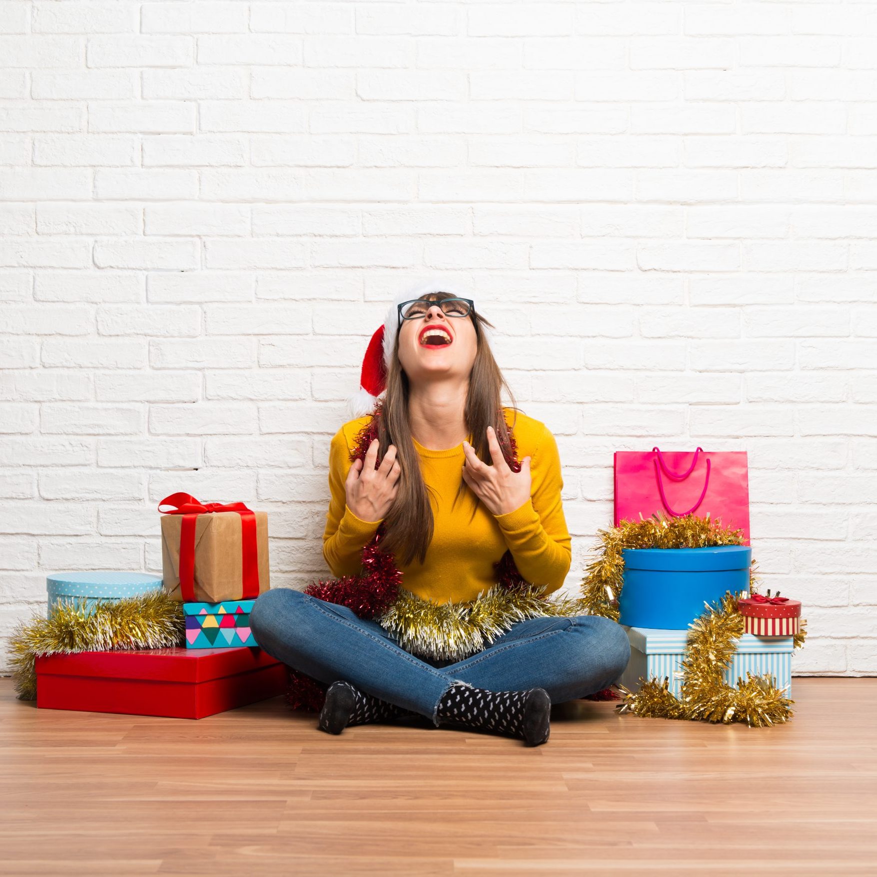Girl celebrating the christmas holidays annoyed angry in furious gesture